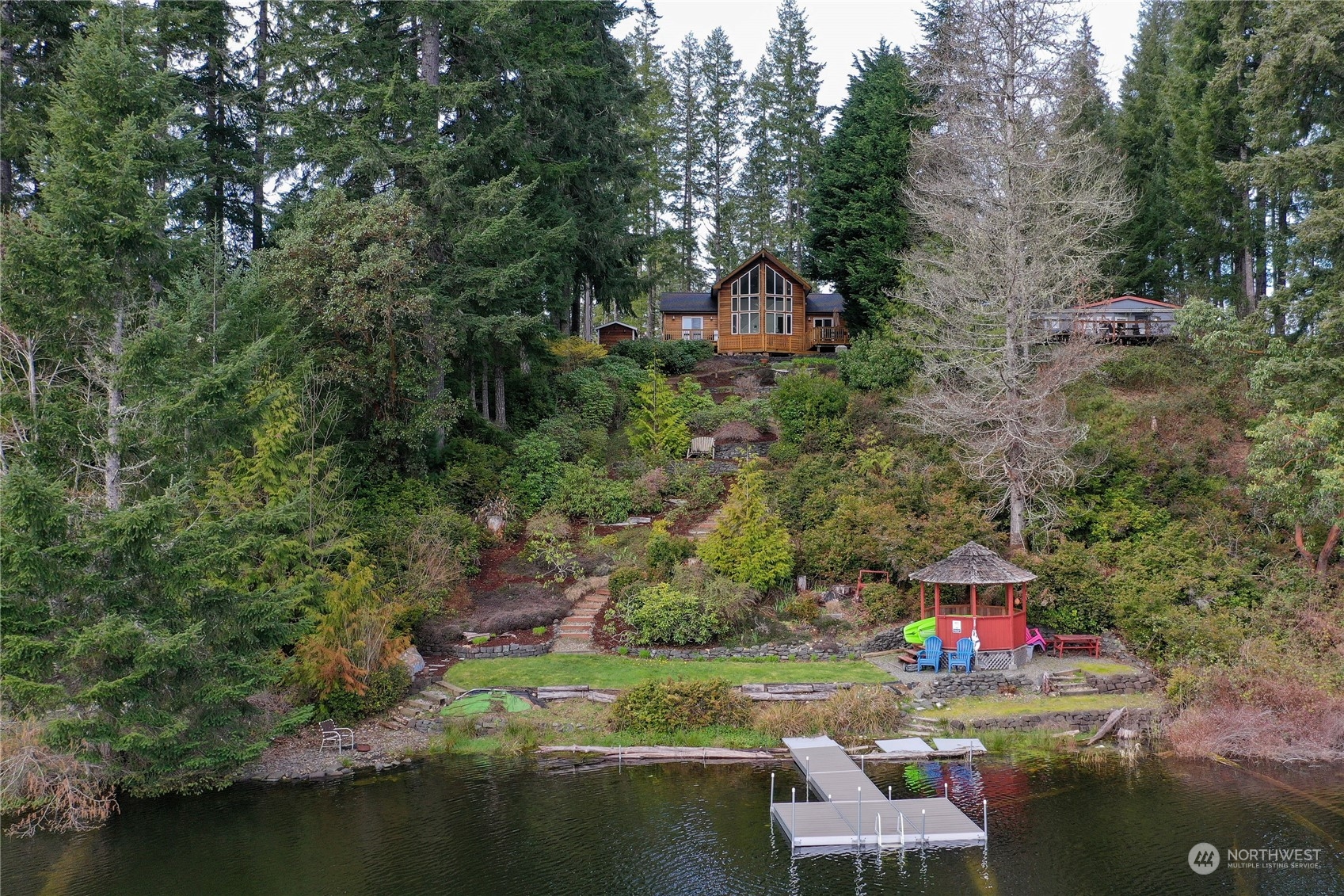 a backyard of a house with a yard and lake view