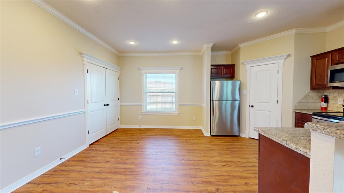 2900 Horseback Court College Station, TX 77845 - Photo 11 of 47 a view of a kitchen cabinets and wooden floor