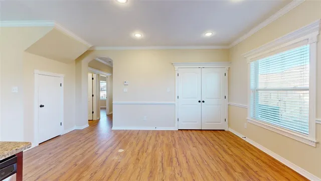 a view of a kitchen cabinets and wooden floor
