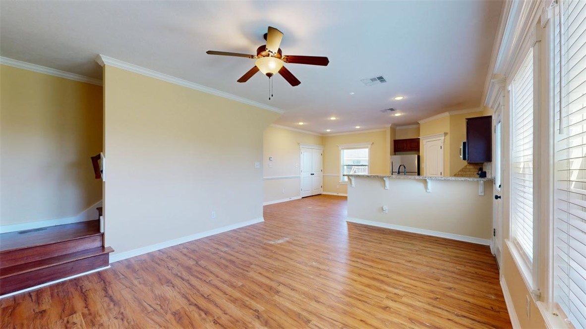 2900 Horseback Court College Station, TX 77845 - Photo 20 of 47 a view of an empty room with wooden floor and a window