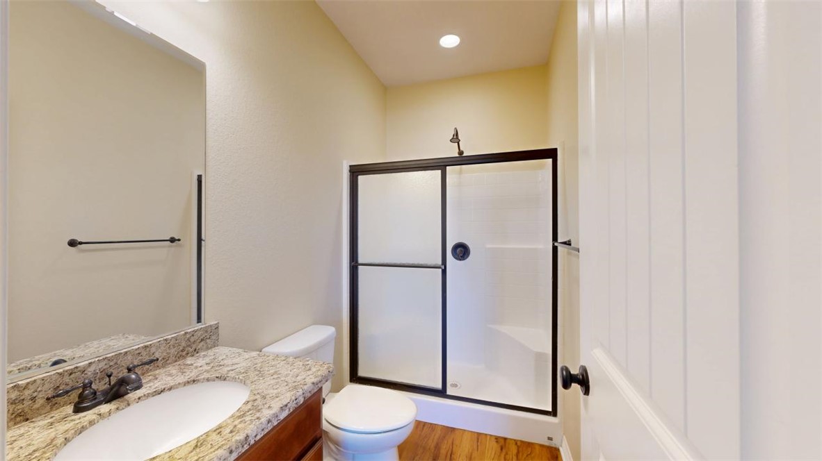2900 Horseback Court College Station, TX 77845 - Photo 25 of 47 a bathroom with a granite countertop sink toilet and shower