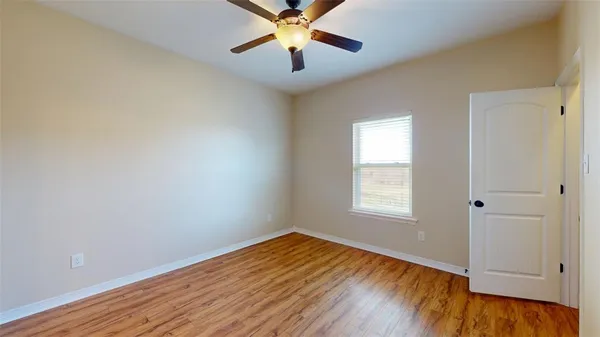 a view of bathroom with wooden floor