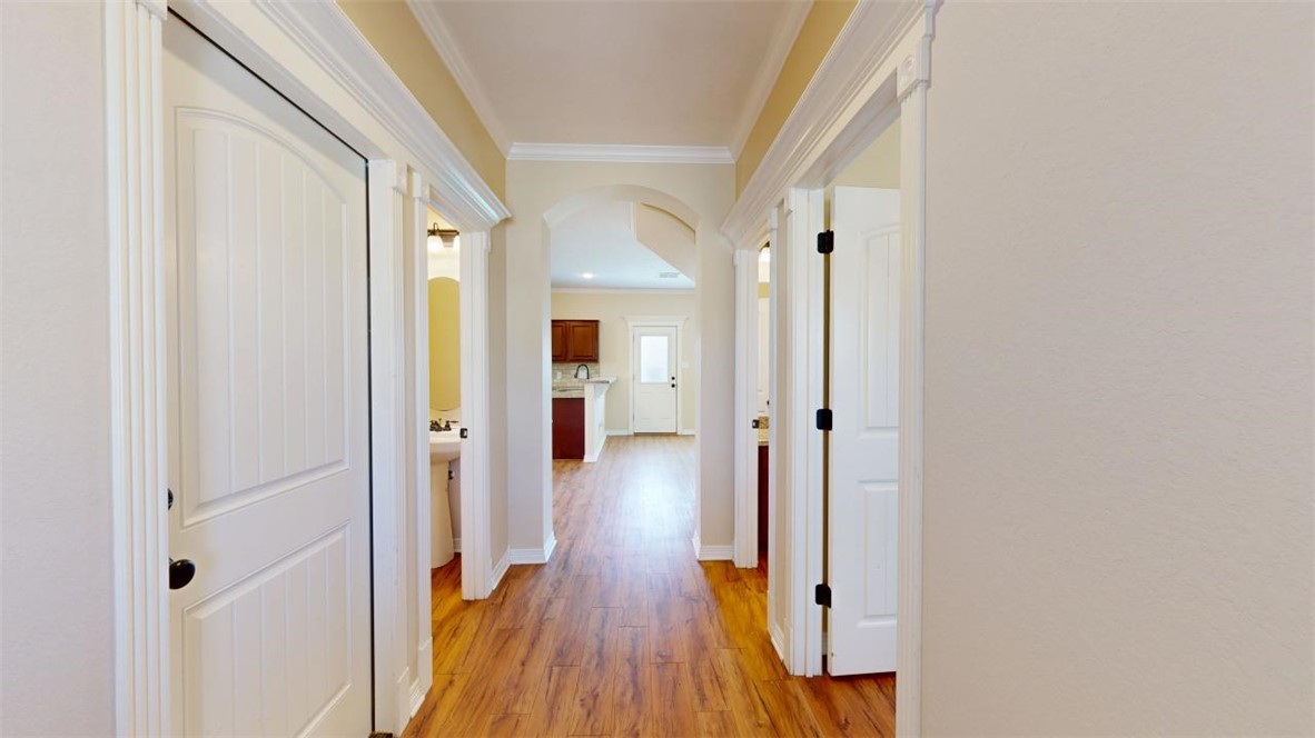 2900 Horseback Court College Station, TX 77845 - Photo 3 of 47 a view of a hallway with wooden floor and staircase