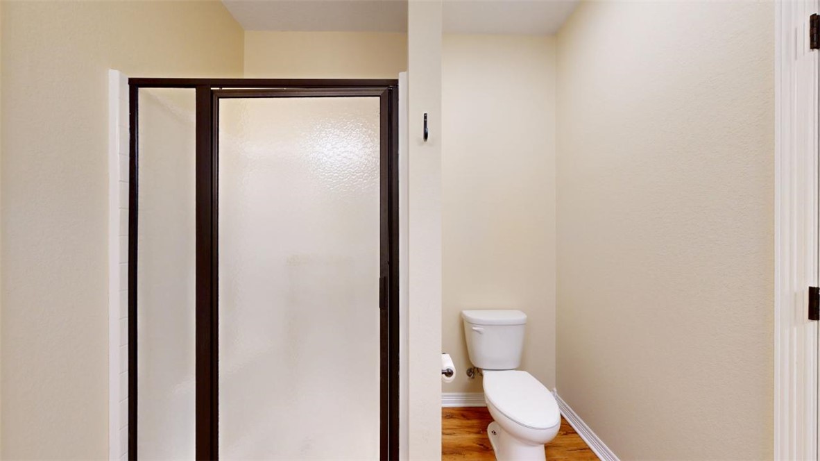 2900 Horseback Court College Station, TX 77845 - Photo 32 of 47 a white toilet sitting next to a shower