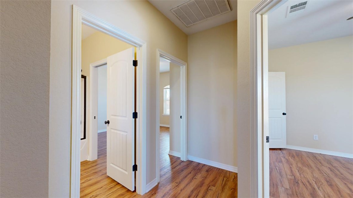 2900 Horseback Court College Station, TX 77845 - Photo 37 of 47 a view of a hallway with wooden floor and closet