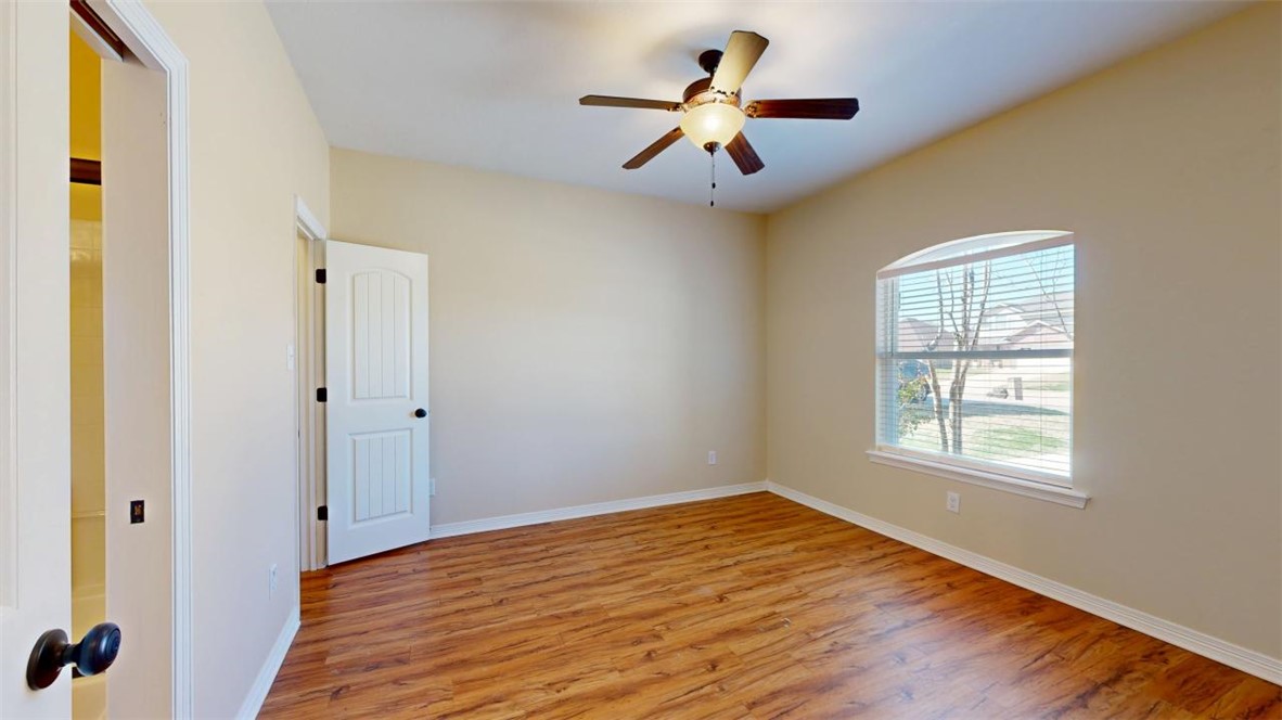 2900 Horseback Court College Station, TX 77845 - Photo 4 of 47 a view of a big room with wooden floor and windows