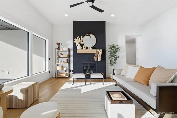 a living room with furniture and a chandelier