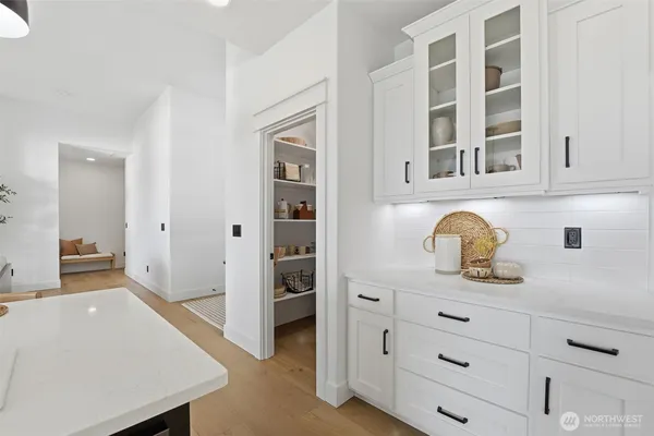 a kitchen with a refrigerator and cabinets