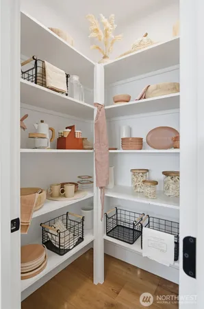 a bedroom with white cabinets