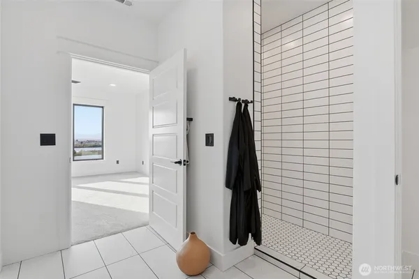 a bathroom with a bathtub and a shower