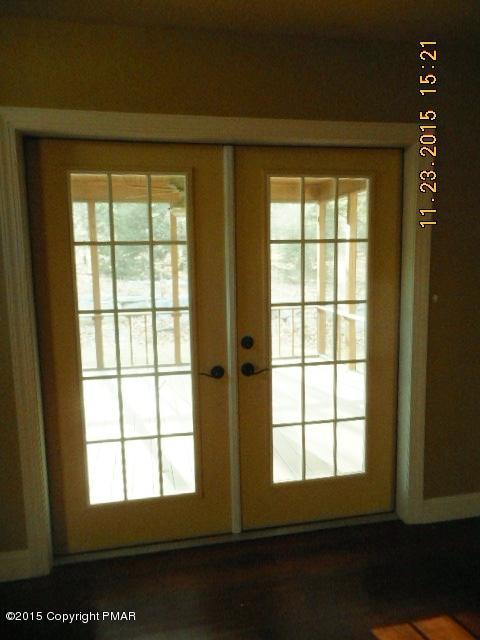 341 Ridge Circle Cresco, PA 18326 - Photo 16 of 24 a view of an empty room with wooden floor and a window