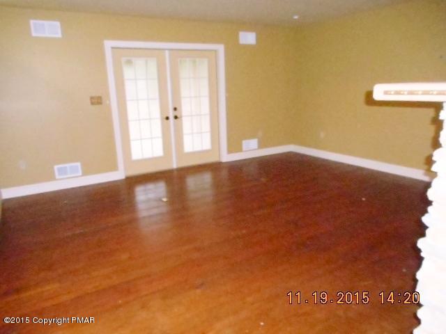 341 Ridge Circle Cresco, PA 18326 - Photo 6 of 24 a view of empty room with wooden floor