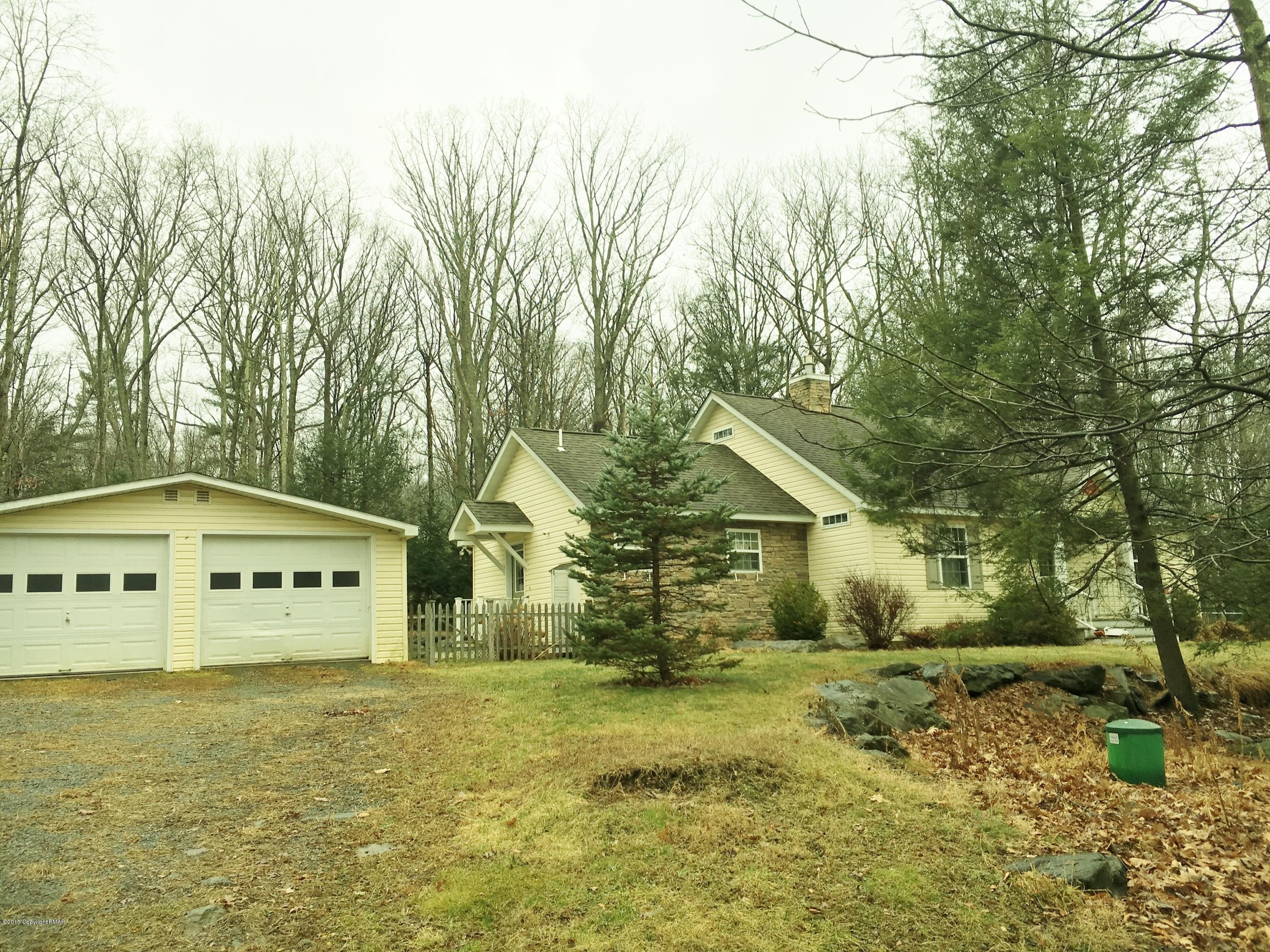 341 Ridge Circle Cresco, PA 18326 - Photo 7 of 24 a view of a large white house next to a yard with large trees