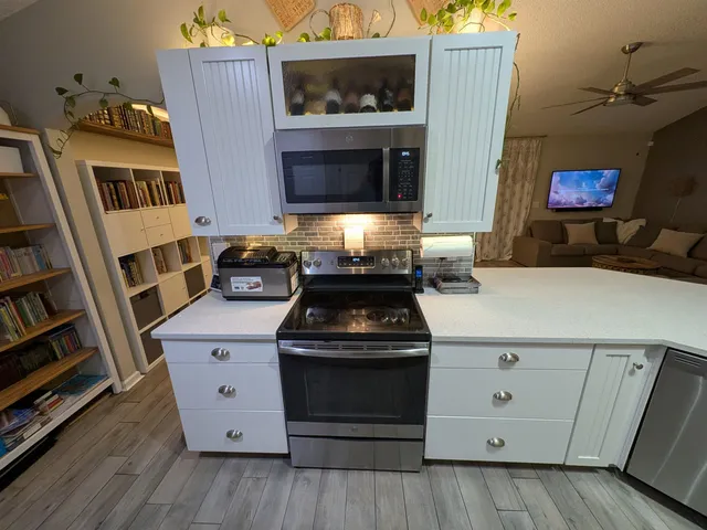 a kitchen with a stove and a microwave