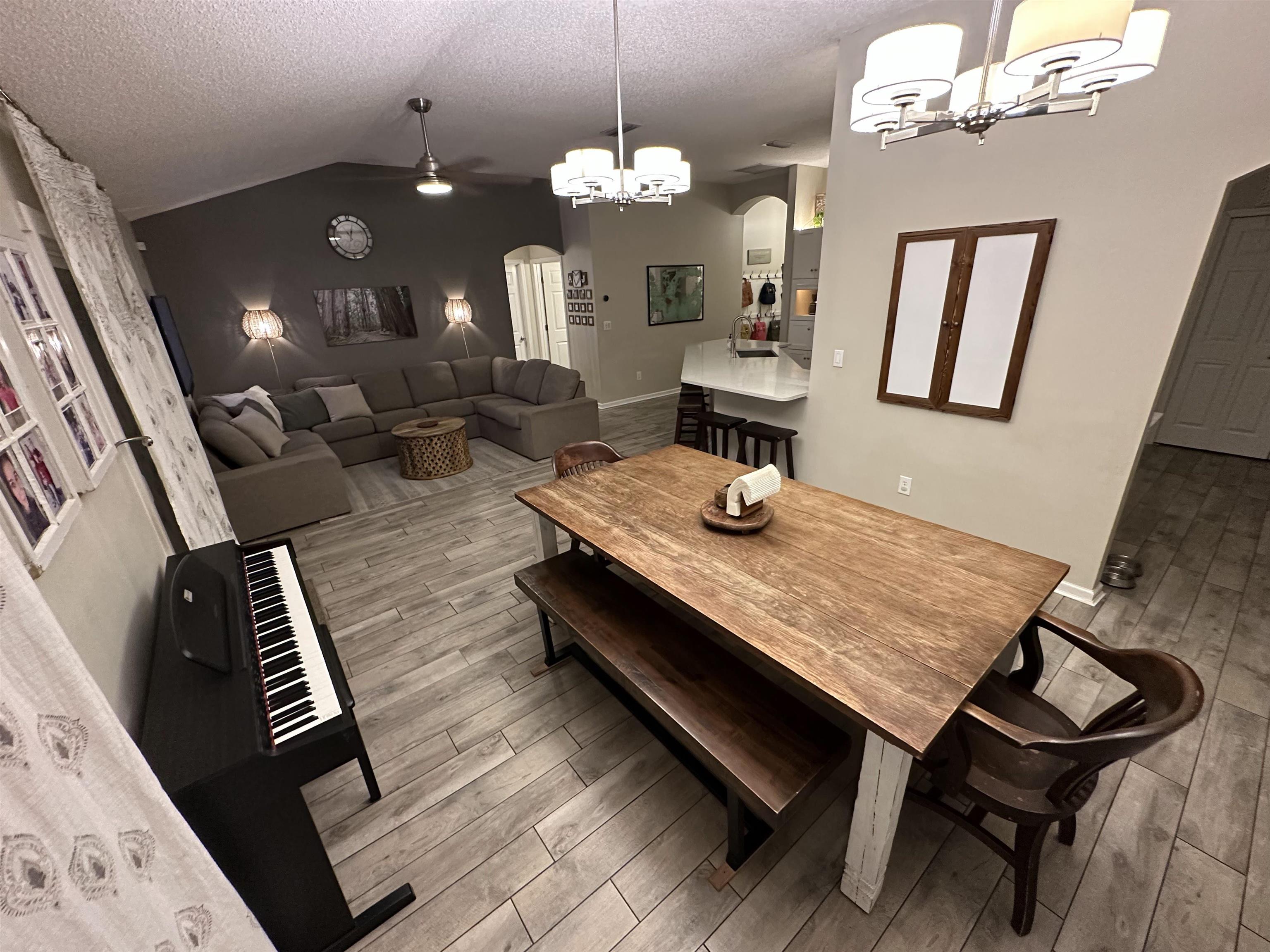 921 Oak Arbor Circle St. Augustine, FL 32084 - Photo 21 of 51 a view of a dining room with furniture and a chandelier