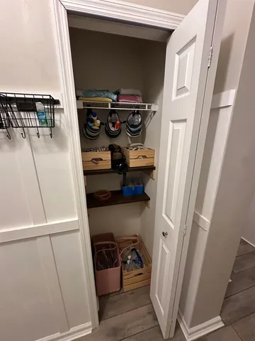 a balcony with table and chairs