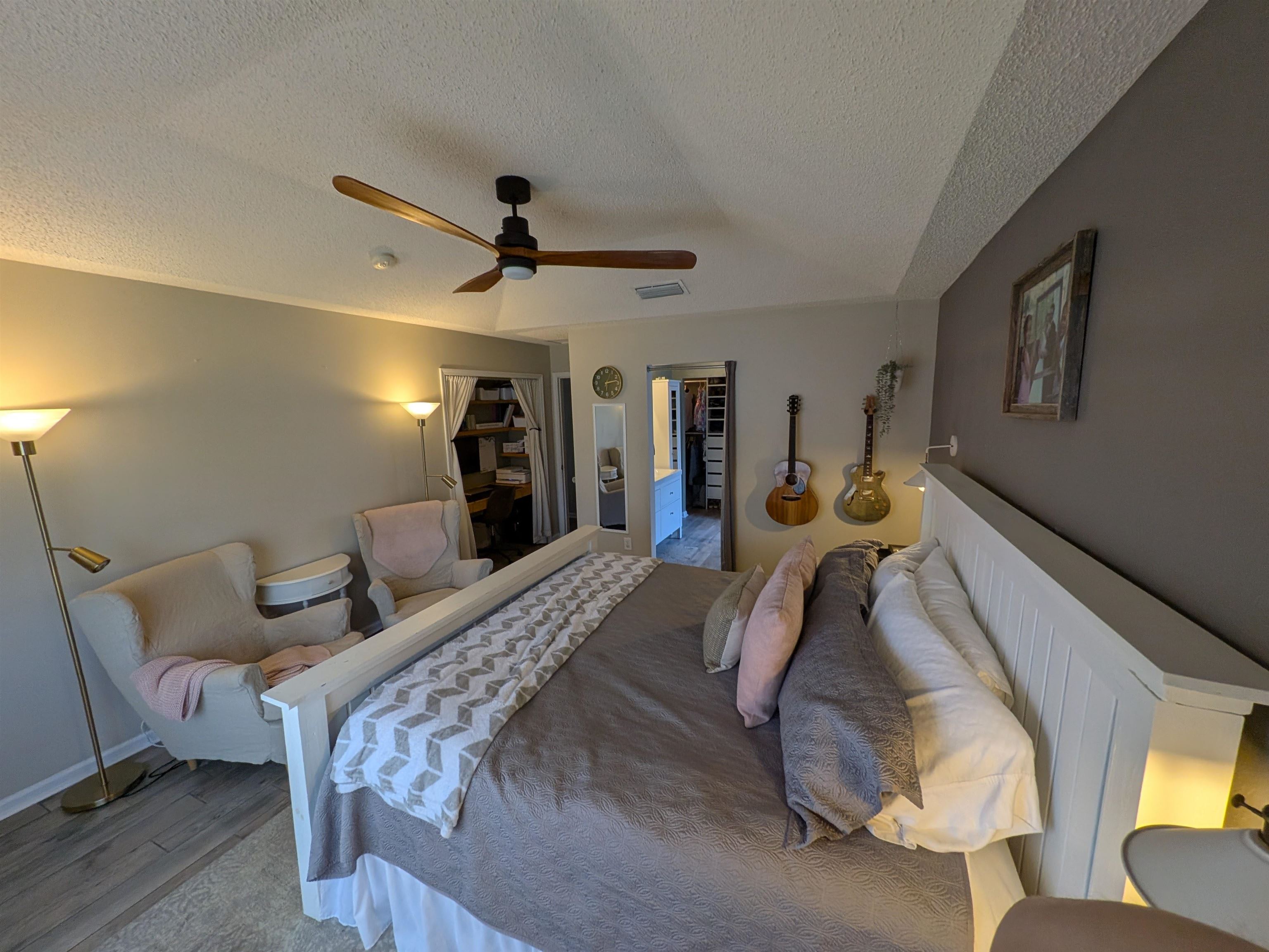 921 Oak Arbor Circle St. Augustine, FL 32084 - Photo 27 of 51 a bed room with a bed and a walk in closet