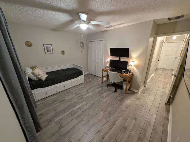 a view of a living room and hardwood floor