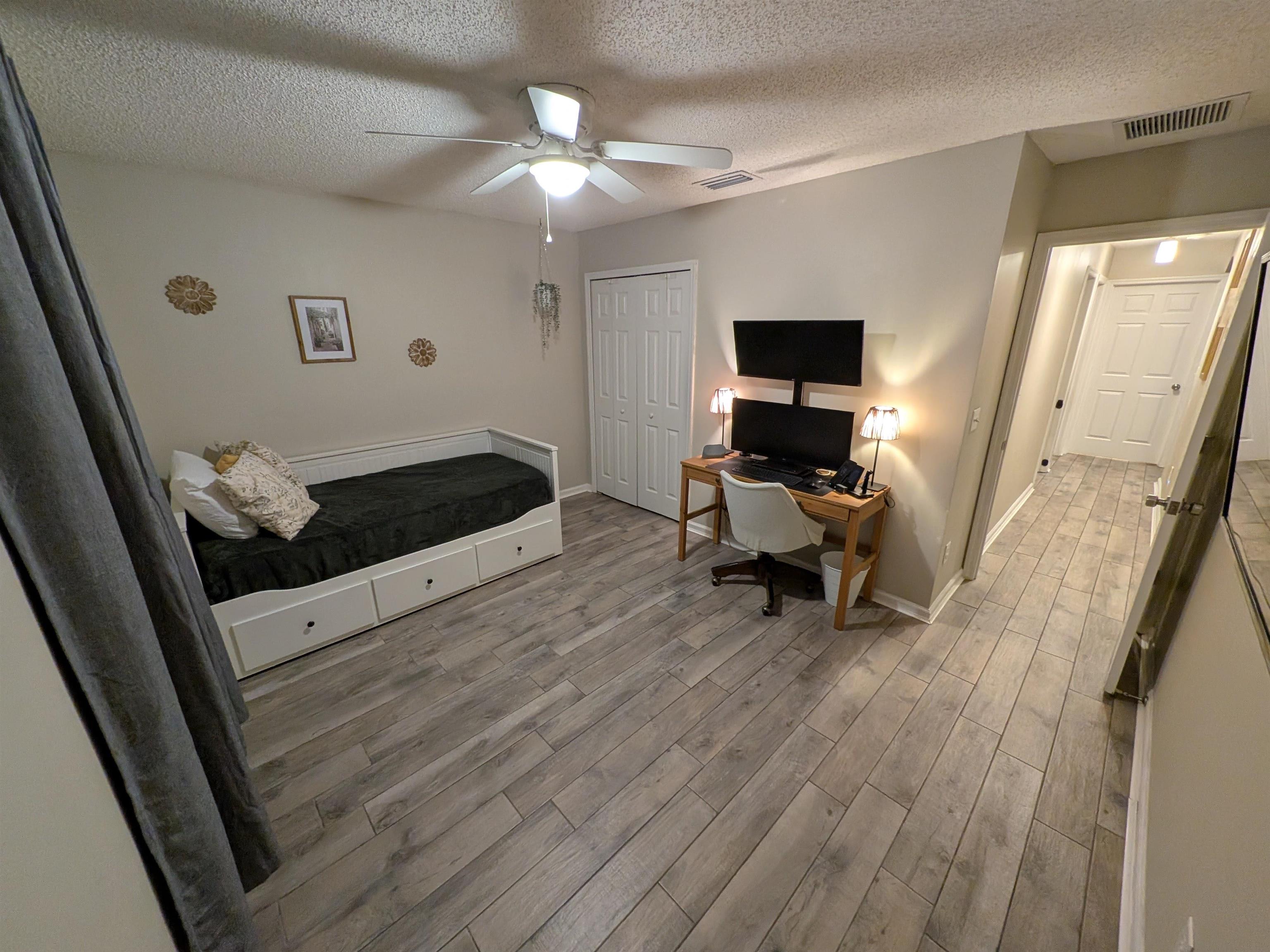 921 Oak Arbor Circle St. Augustine, FL 32084 - Photo 36 of 51 a living room with furniture and a flat screen tv