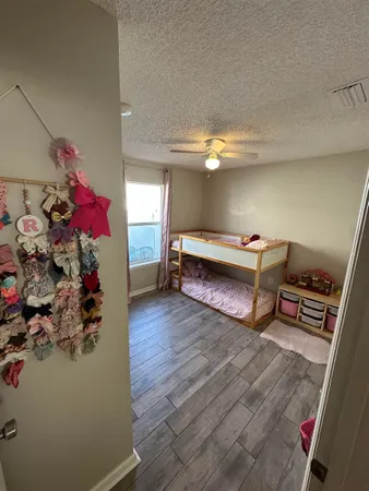 a bedroom with bed and a window