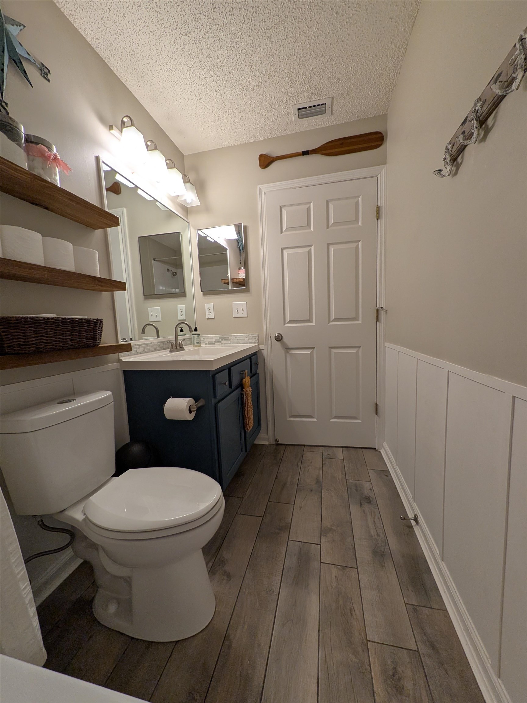 921 Oak Arbor Circle St. Augustine, FL 32084 - Photo 49 of 51 a bathroom with a toilet sink and mirror