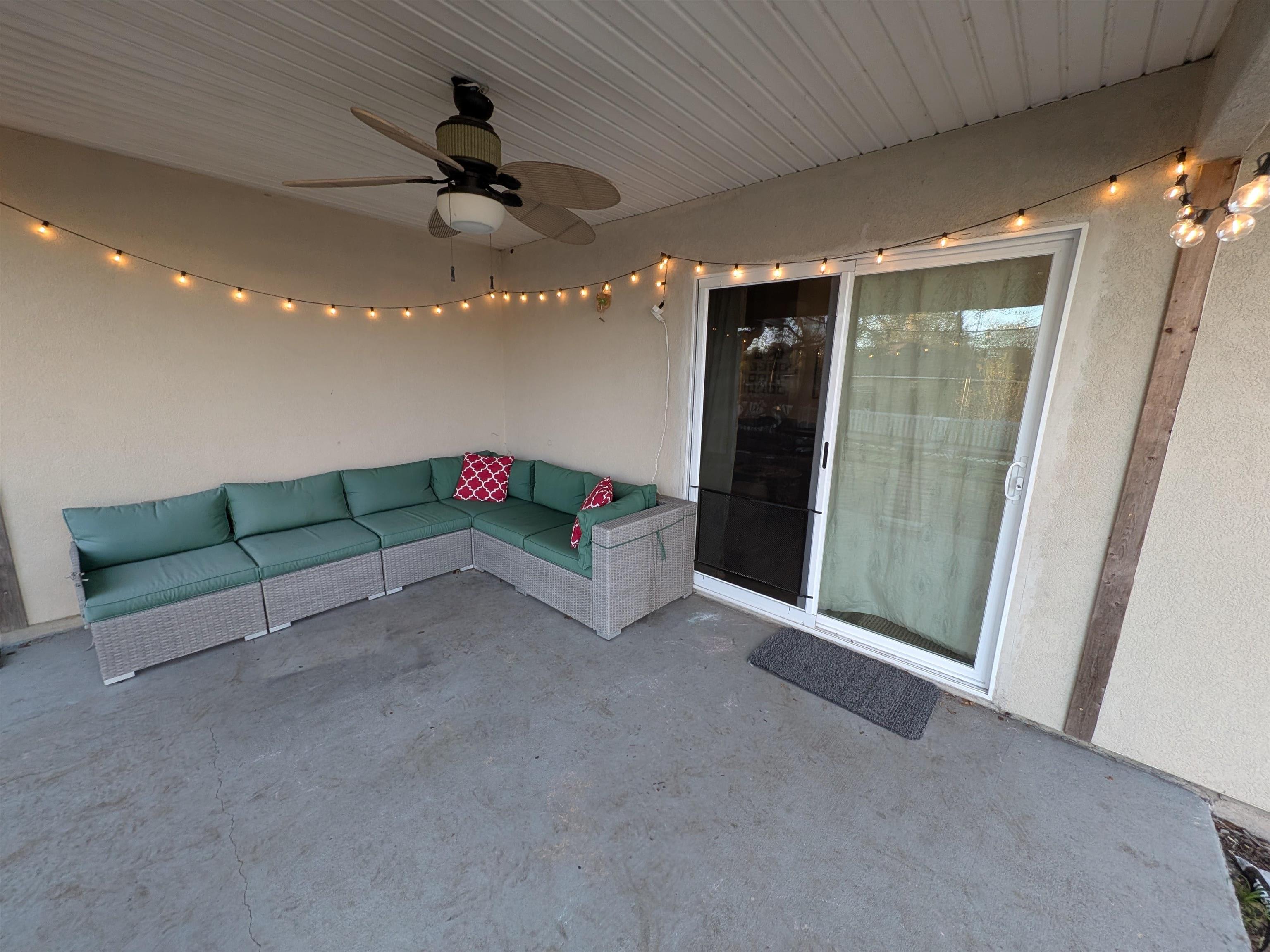 921 Oak Arbor Circle St. Augustine, FL 32084 - Photo 50 of 51 a living room with furniture and a ceiling fan