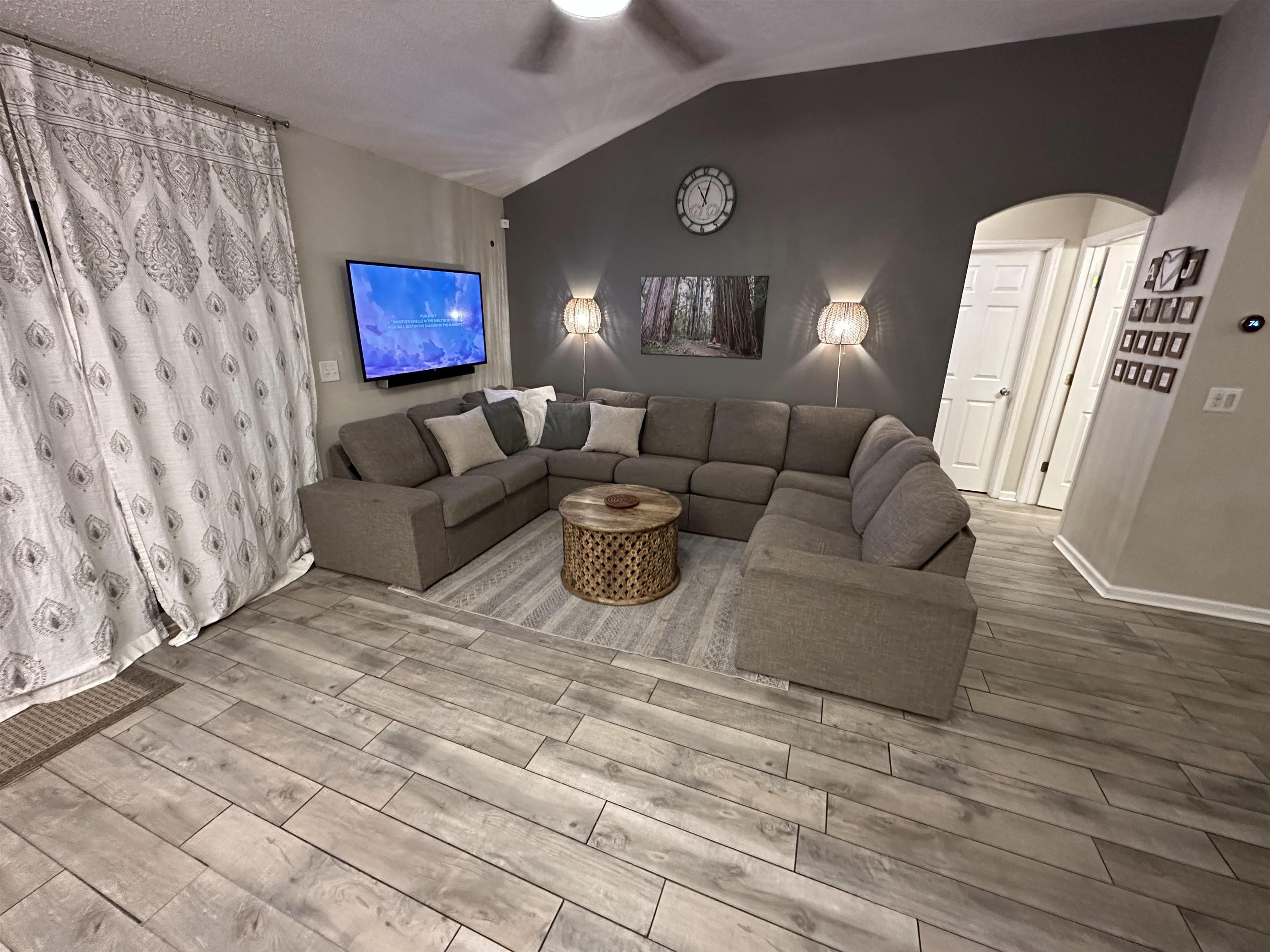 921 Oak Arbor Circle St. Augustine, FL 32084 - Photo 8 of 51 a living room with furniture and a fireplace