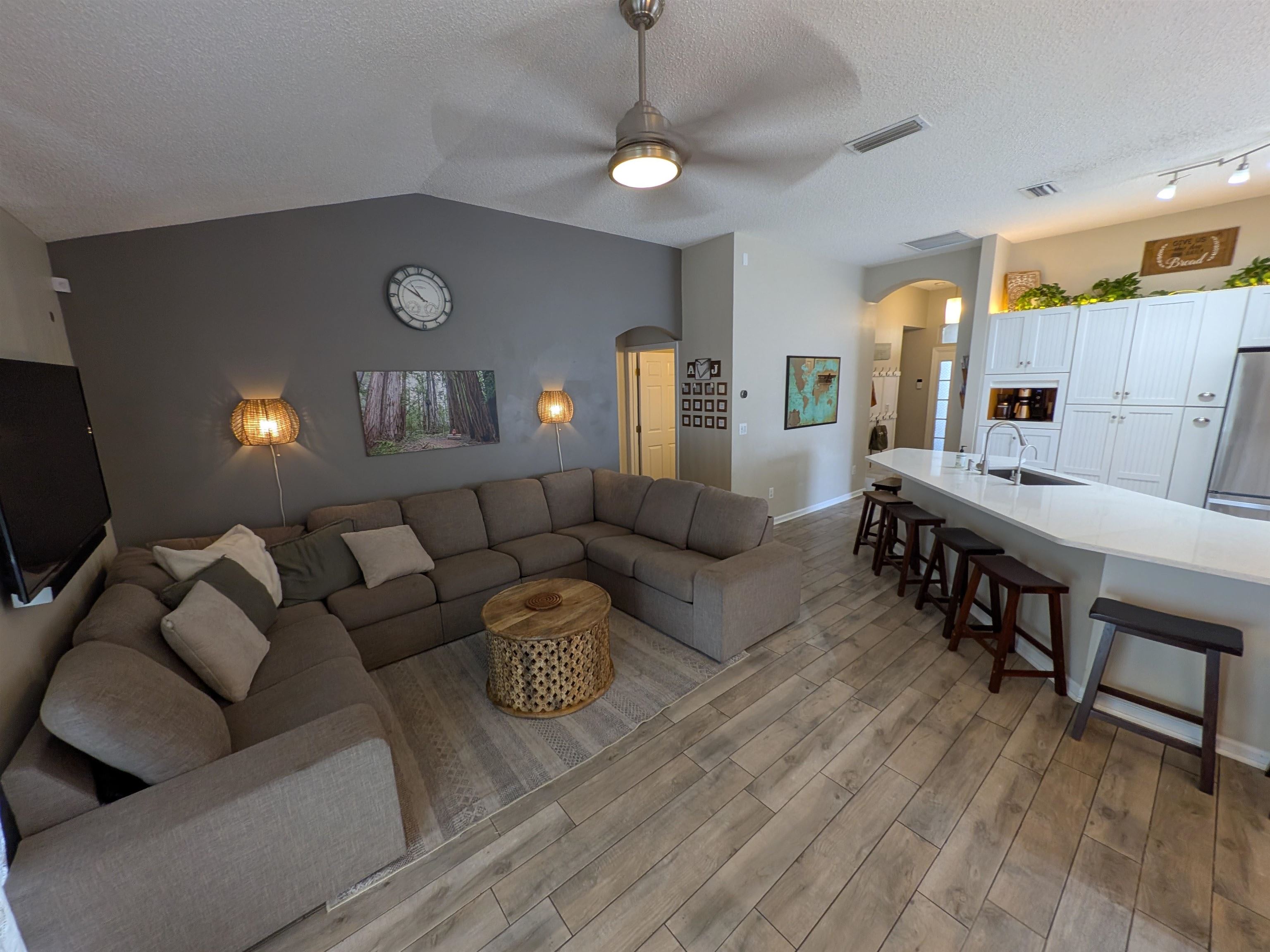 921 Oak Arbor Circle St. Augustine, FL 32084 - Photo 10 of 51 a living room with furniture and a wooden floor