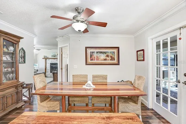 a spacious bedroom with a bed and a chandelier