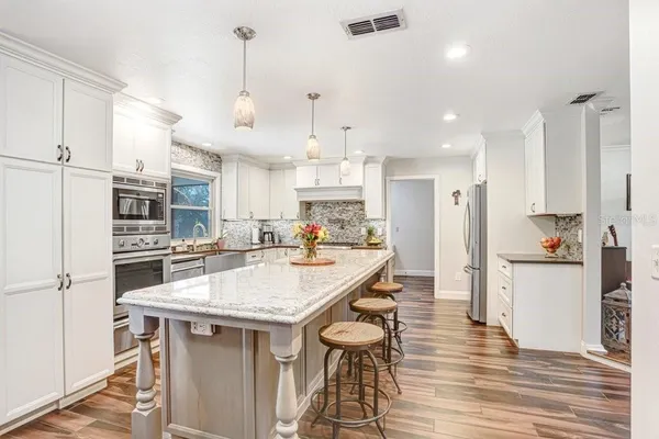 a spacious bathroom with a shower and a sink