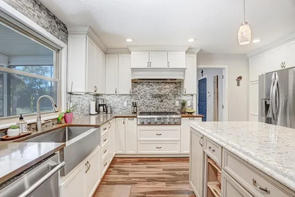 a bathroom with a sink a mirror and a shower