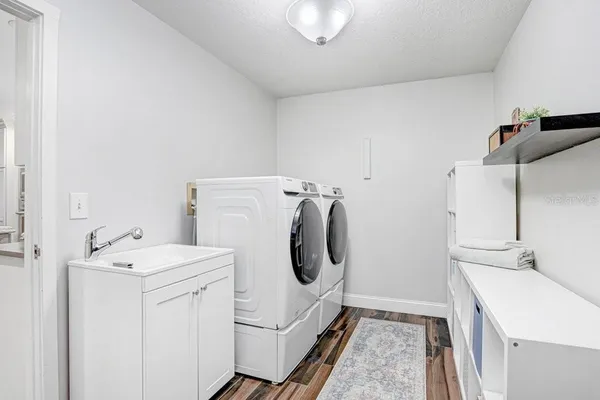 a kitchen with stainless steel appliances granite countertop a sink and cabinets