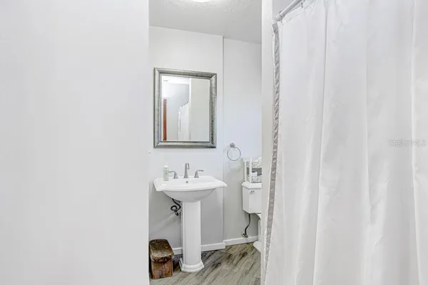 a bed room with a bed and a flat screen tv