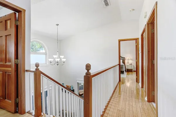 a dining room with furniture and a chandelier