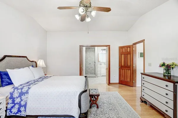 a man is sitting on a bench in front of a building