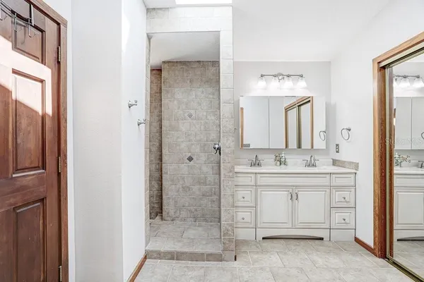 a view of a patio with a table chairs and a potted plant