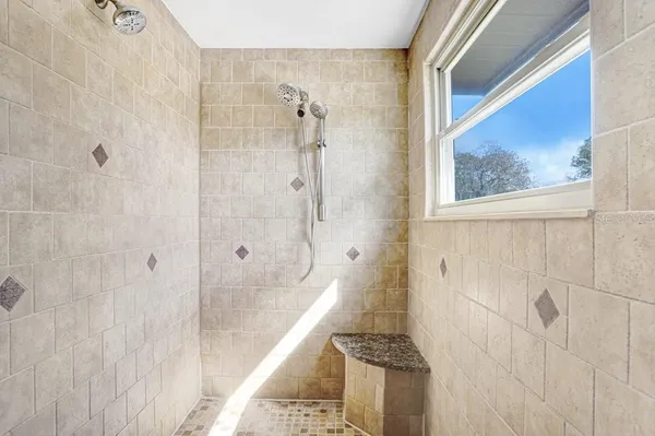 a view of a tree in front of a house