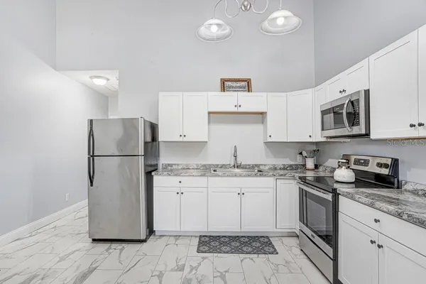 an aerial view of a house with a yard and garden