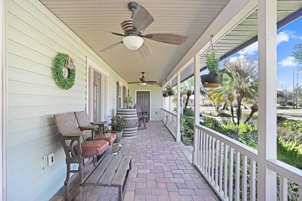 a living room with furniture wooden floor and a table