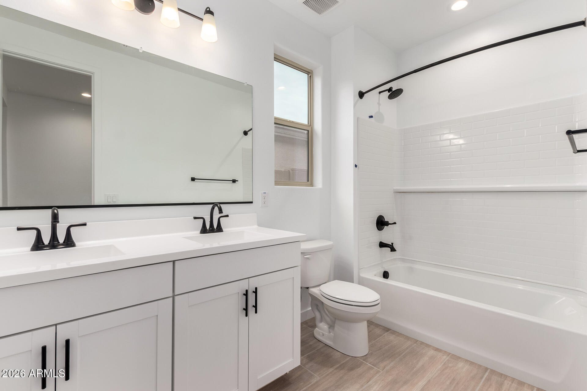 8026 West Granada Road Phoenix, AZ 85035 - Photo 17 of 31 a bathroom with a toilet sink and a bathtub