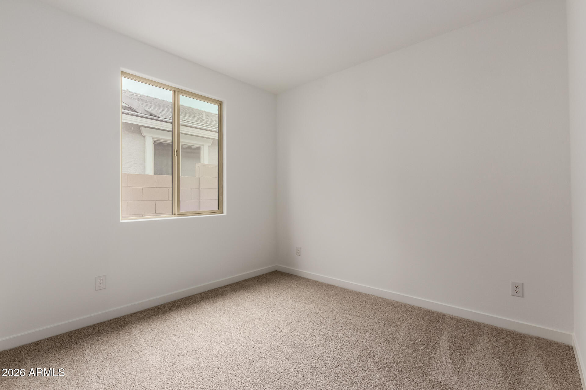 8026 West Granada Road Phoenix, AZ 85035 - Photo 18 of 31 an empty room with a window