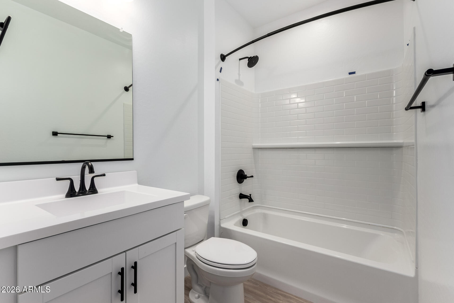 8026 West Granada Road Phoenix, AZ 85035 - Photo 20 of 31 a bathroom with a sink a toilet and a bathtub