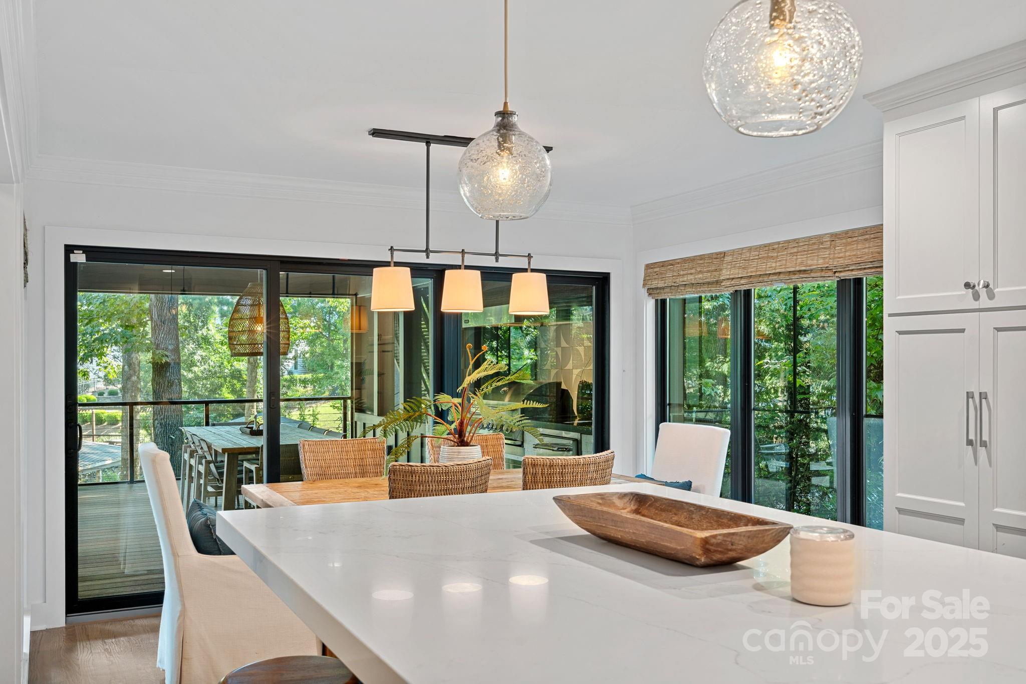 19624 Meta Road Cornelius, NC 28031 - Photo 11 of 44 a view of a dining room with furniture window and outside view