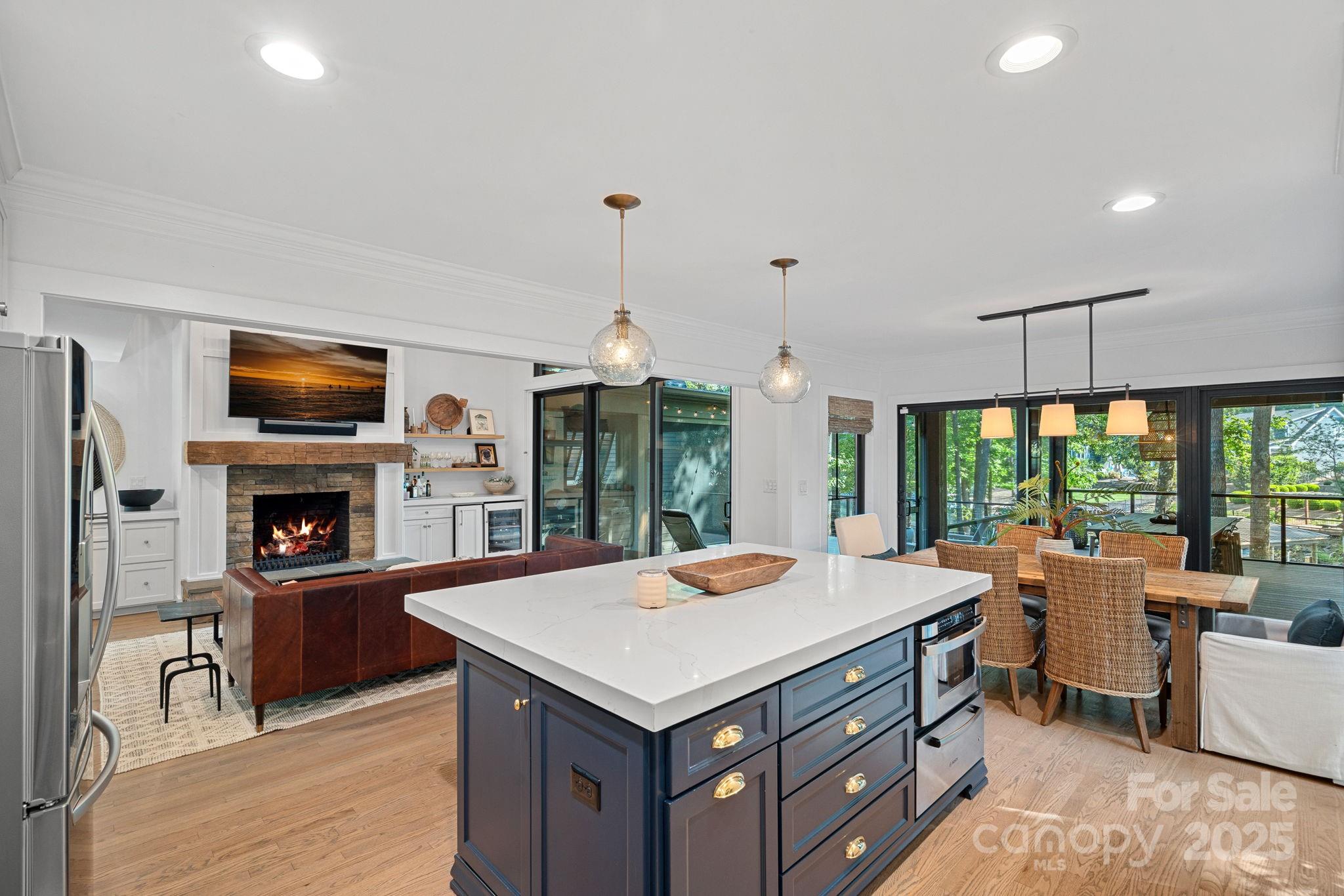 19624 Meta Road Cornelius, NC 28031 - Photo 14 of 44 a kitchen with a stove a refrigerator and a fireplace