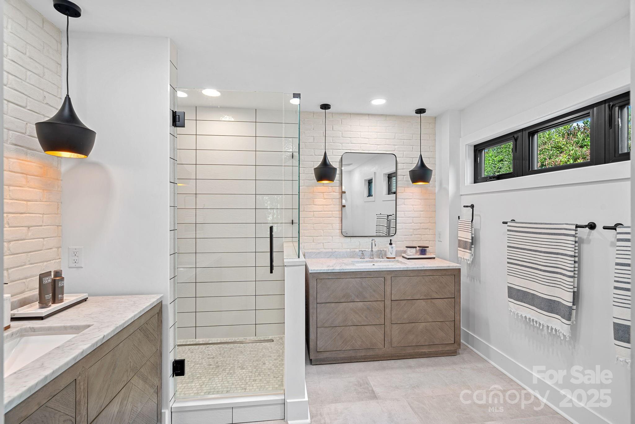 19624 Meta Road Cornelius, NC 28031 - Photo 20 of 44 a bathroom with a sink a toilet and shower