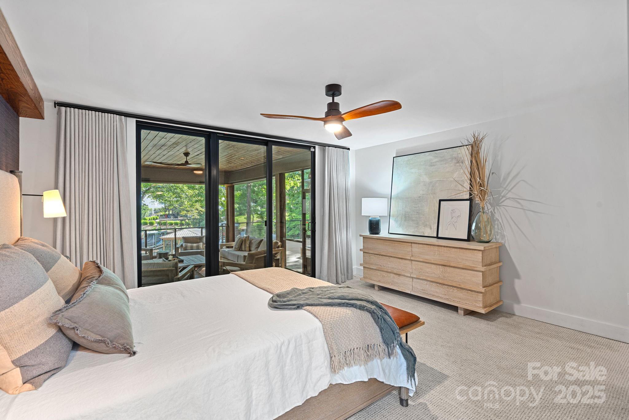 19624 Meta Road Cornelius, NC 28031 - Photo 22 of 44 a bedroom with a bed and a large window