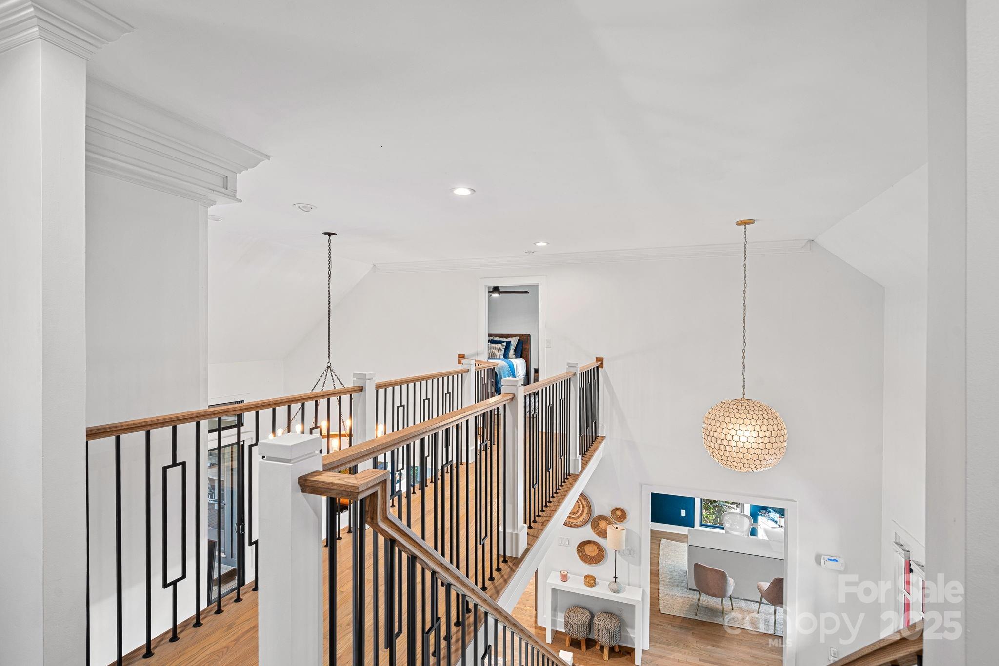 19624 Meta Road Cornelius, NC 28031 - Photo 23 of 44 a view of a room with wooden floor and staircase