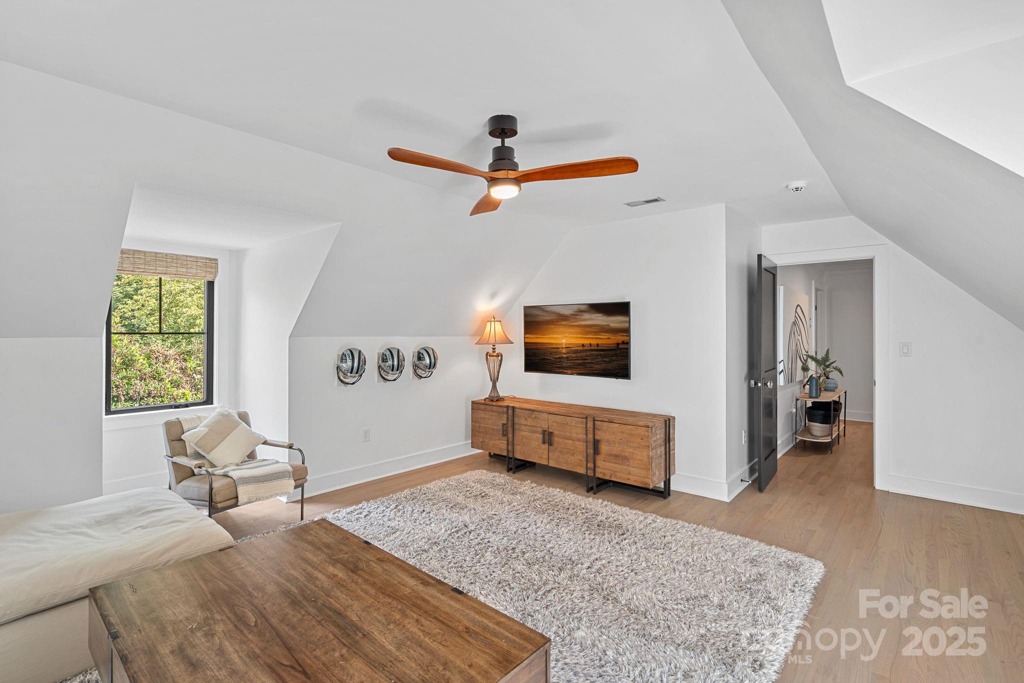 19624 Meta Road Cornelius, NC 28031 - Photo 27 of 44 a bedroom with a bed and wooden floor
