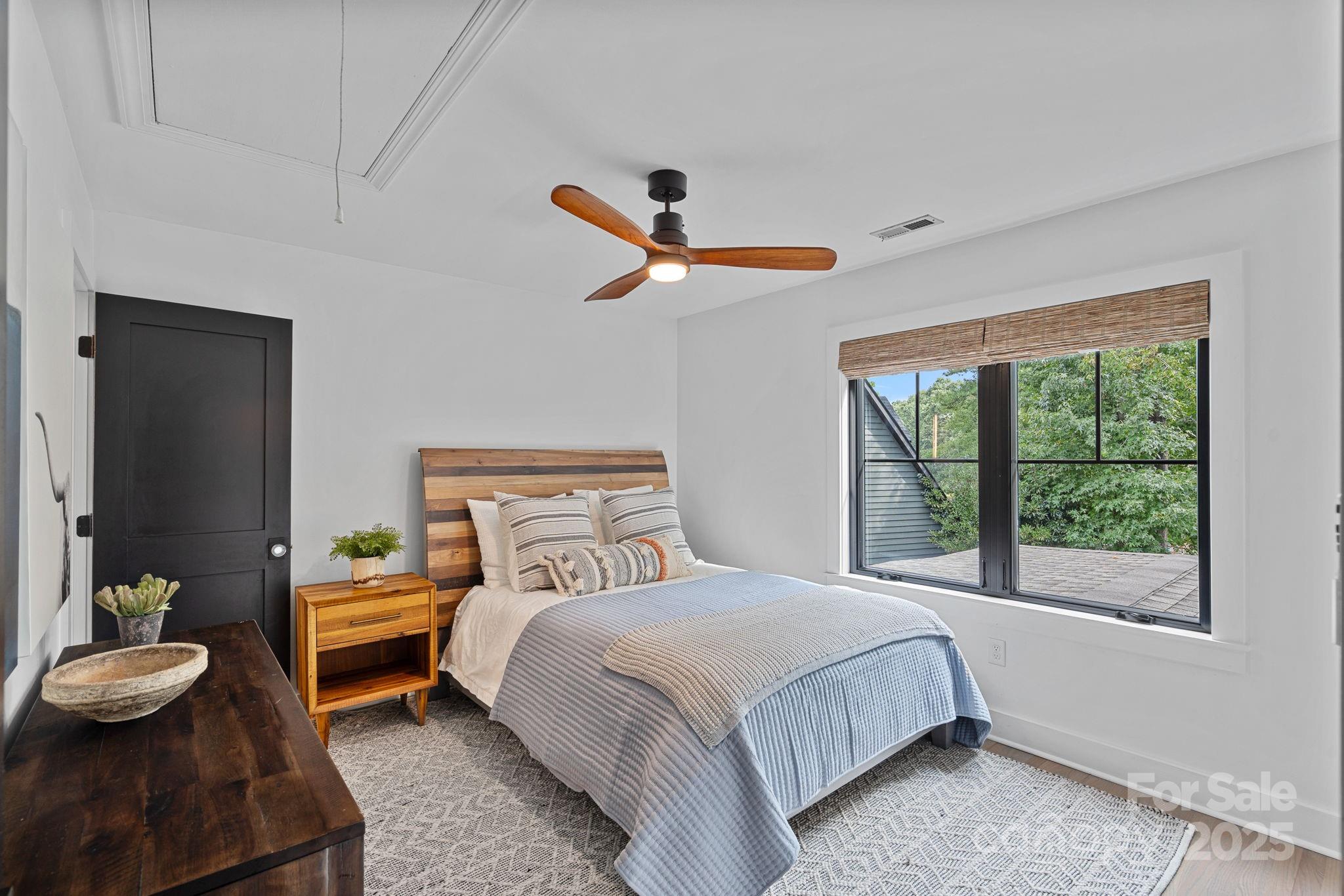 19624 Meta Road Cornelius, NC 28031 - Photo 28 of 44 a bedroom with a bed and a large window
