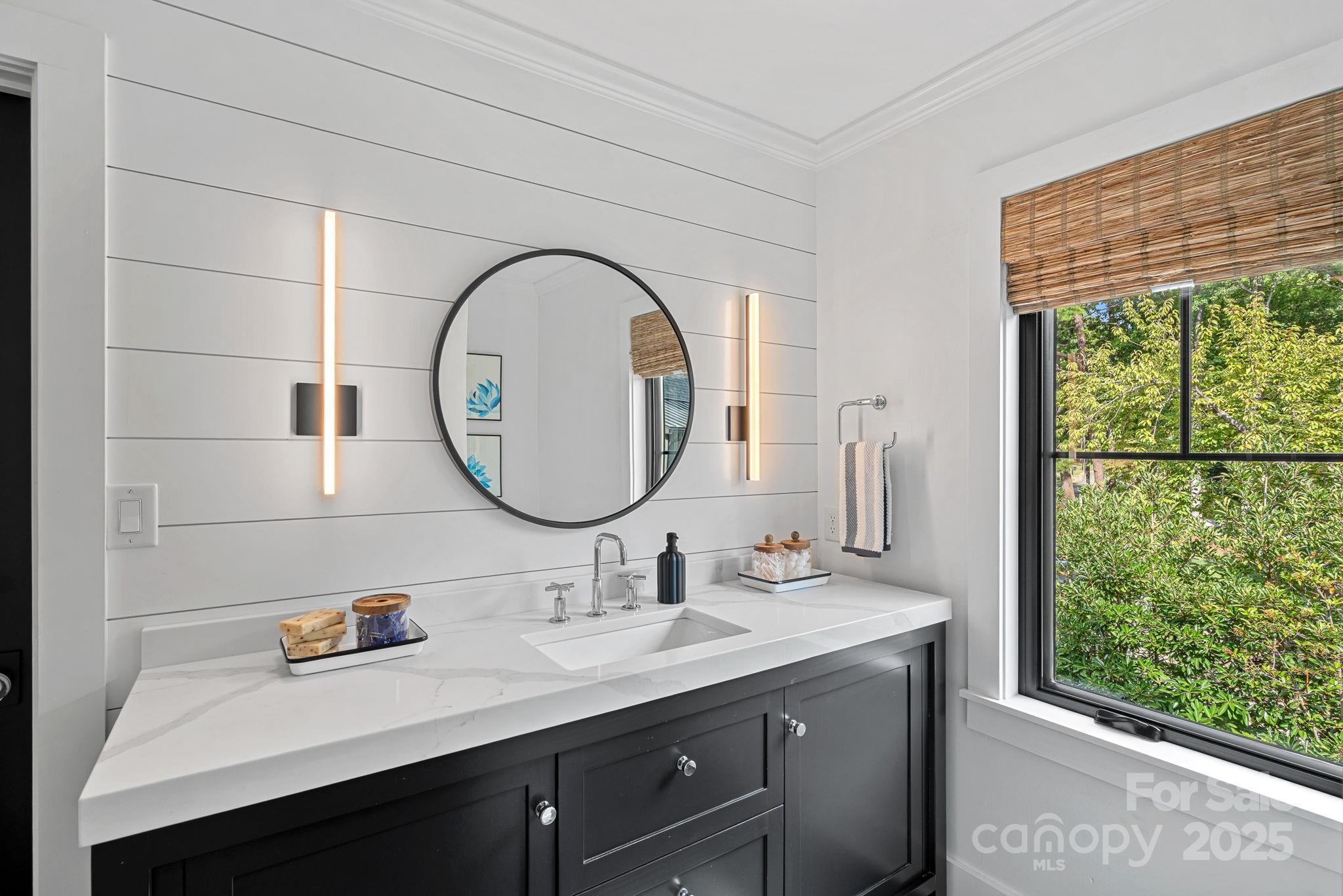 19624 Meta Road Cornelius, NC 28031 - Photo 29 of 44 a bathroom with a double vanity sink and a mirror